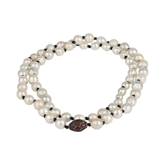 Elegant baroque pearls necklace with garnets and diamonds ball centerpiece, featuring a vibrant and delicate design.