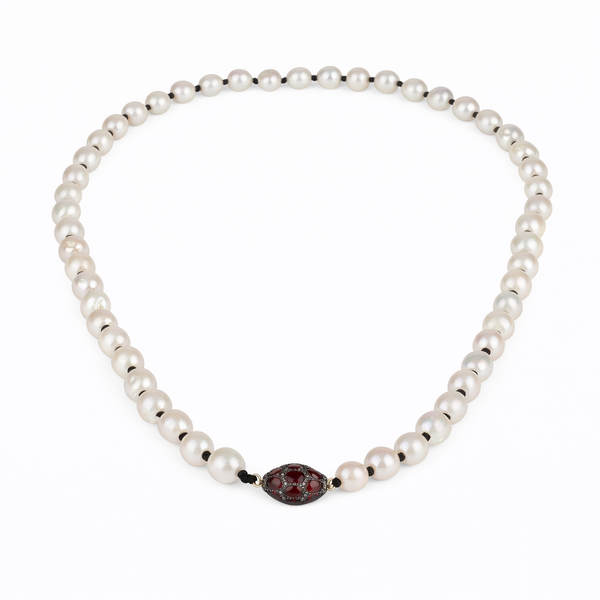 Elegant baroque pearls necklace with a garnets and diamonds ball