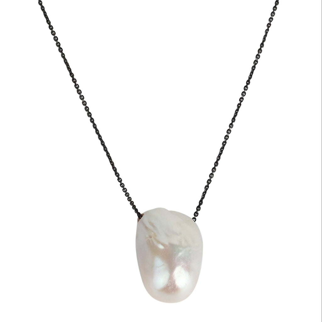 Elegant baroque pearl pendant necklace with black chain, featuring a lustrous white freshwater pearl center.