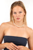 Elegant freshwater pearl choker necklace, showcasing a woman's natural beauty.