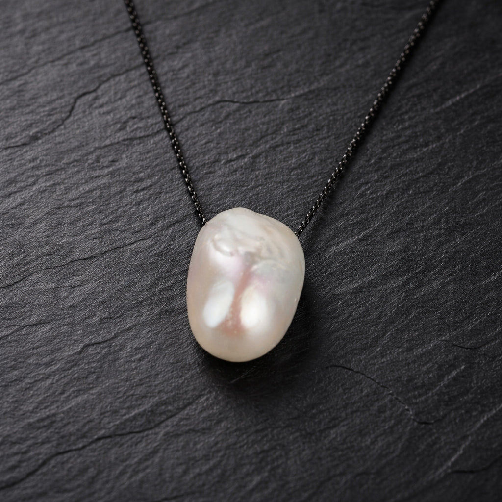 Amanda JLL Pearl necklace on slate – handmade baroque pearl and black oxidized chain