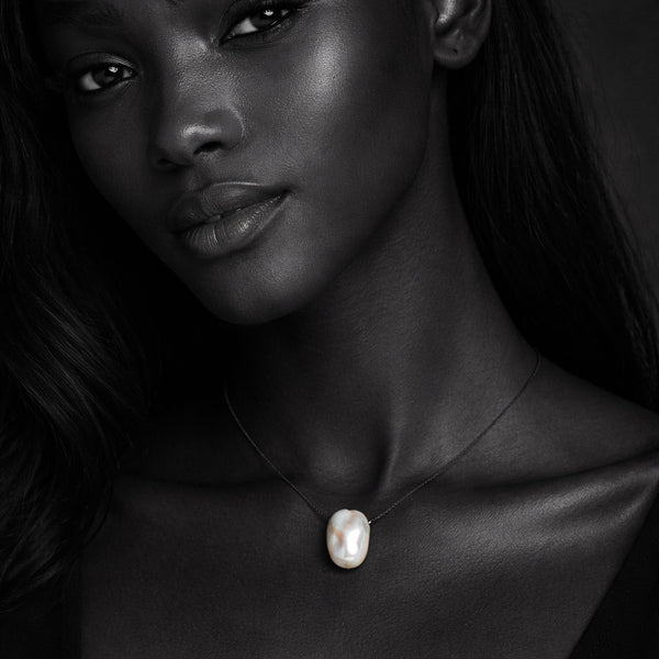Amanda JLL Pearl necklace with a large baroque freshwater pearl on a black chain.