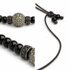 Close-up of Hydra necklace – black spinel tops and silver peridot ball detail, JLL Pearl