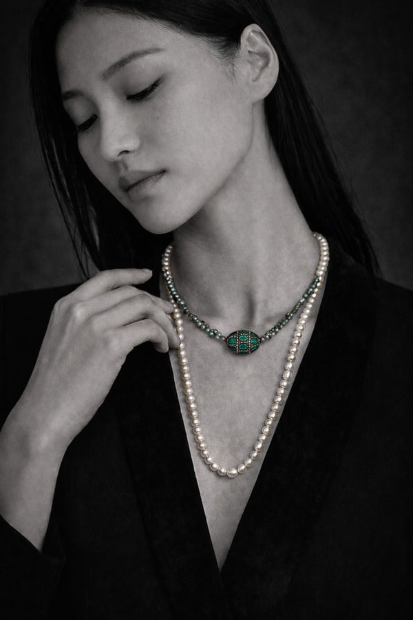 Beautiful Pearls necklace Lola with a green emerald and diamonds pendant on model-JLLpearl