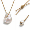 Close-up of Mila necklace – baroque freshwater pearl and white topaz stars in gold plating, JLL Pearl