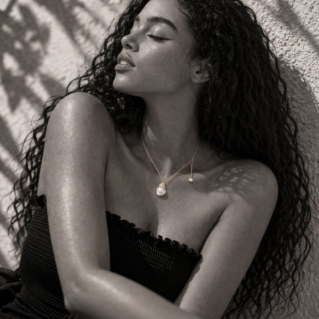 JLL Pearl Mila necklace worn – large baroque pearl and gold-plated topaz star detail