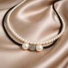 Mina JLL Pearl necklace on fabric – long pearl and spinel necklace with white topaz accent