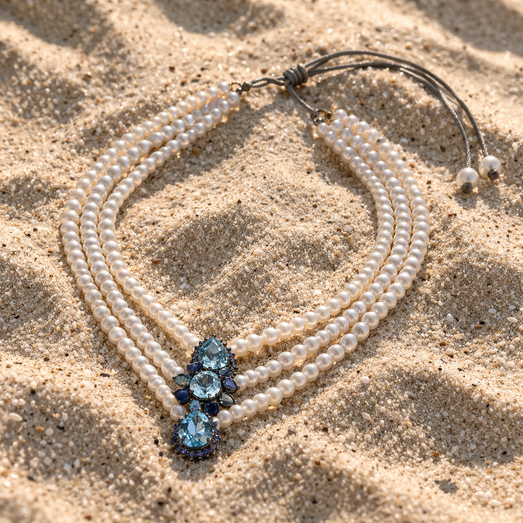 Nilufar pearl necklace by JLL Pearl on sand – sapphire, blue topaz and AA freshwater pearls