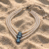 Nilufar pearl necklace by JLL Pearl on sand – sapphire, blue topaz and AA freshwater pearls