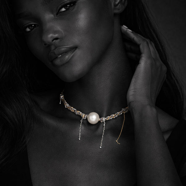 Samos JLL Pearl necklace with a round pearl on a braided silver and gold chain.