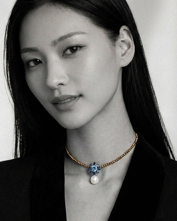 Necklace Flowerdream in Hematites with pearl, Topaz and Sapphire, worn by model-JLLPearl