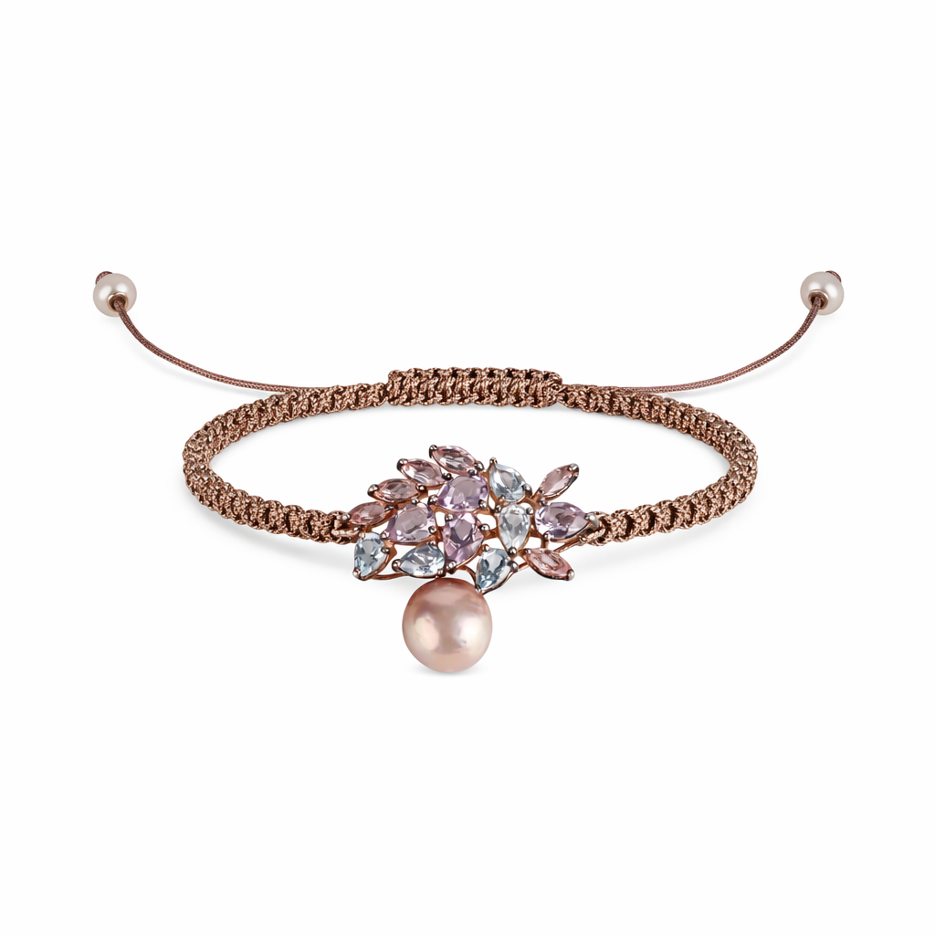 A bracelet featuring a sheet of semi-precious stones with shades of blue and pink topazes and amethysts, and a pink pearl.