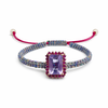 Bracelet with a purple gemstone on a white background
