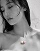 Bocca baroque pearl necklace silver chain worn by Asian model, selective color portrait, two mismatched freshwater pearls in cream and pink-mauve against black and white skin, handmade by JLL Pearl in Greece