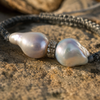 Close-up Butterfly bracelet — two baroque grey pearls and topaz rondelle on Greek stone, iridescent nacre