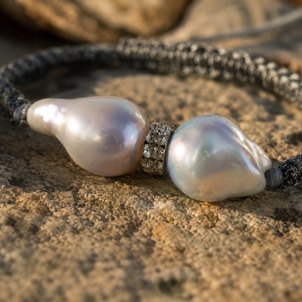 Close-up Butterfly bracelet — two baroque grey pearls and topaz rondelle on Greek stone, iridescent nacre