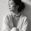 Woman wearing Cassiopea double-strand pearl necklace with rectangular blue sapphire centerpiece — JLL Pearl
