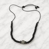 Hydra black onyx beaded necklace with grey pavé centerpiece, flatlay on white marble — JLL Pearl
