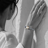Black and white portrait of a drop-shaped baroque pearl bracelet with a gemstone rondelle accent — JLL Pearl