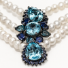 Close-up of blue topaz and sapphire centerpiece on Nilufar pearl necklace, JLL Pearl
