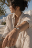 Stella macramé bracelet worn in Greece — champagne star, baroque pearl, natural Mediterranean light